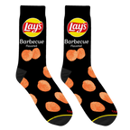Close-up studio shot of a pair of black Lay's BBQ socks, highlighting the chip design and sock texture.