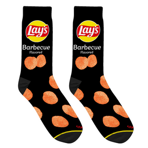 Close-up studio shot of a pair of black Lay's BBQ socks, highlighting the chip design and sock texture.