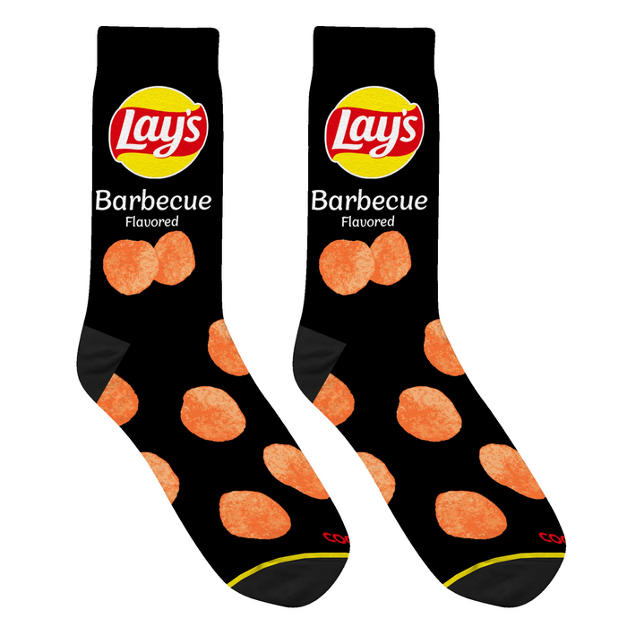 Close-up studio shot of a pair of black Lay's BBQ socks, highlighting the chip design and sock texture.