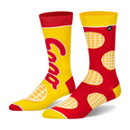 Mismatched crew socks. One is yellow with a red Eggo logo and red accents. The other is red with a yellow waffle pattern.