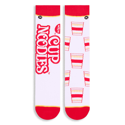Flat lay of white socks side-by-side. Left sock shows large red Cup Noodles text, right sock shows repeating noodle cups.