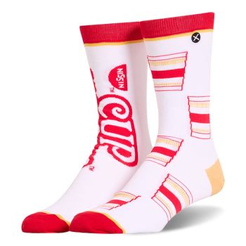White crew socks featuring a mismatched design with a large red Cup Noodles logo on one and a pattern of cups on the other.