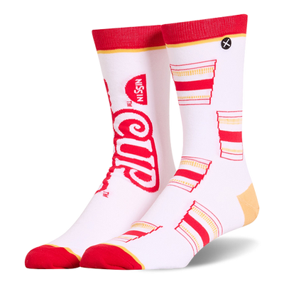 White crew socks featuring a mismatched design with a large red Cup Noodles logo on one and a pattern of cups on the other.