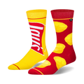 Pair of crew socks. One yellow sock displays the Lay's potato chip bag logo. The other red sock is adorned with yellow potato chip designs.