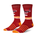 A pair of crew socks in red and orange. The socks feature a Top Ramen Beef design with noodle details and the brand logo.