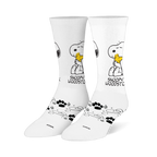 White crew socks showing Snoopy hugging a yellow Woodstock, with black paw prints and swirling line patterns on the foot.