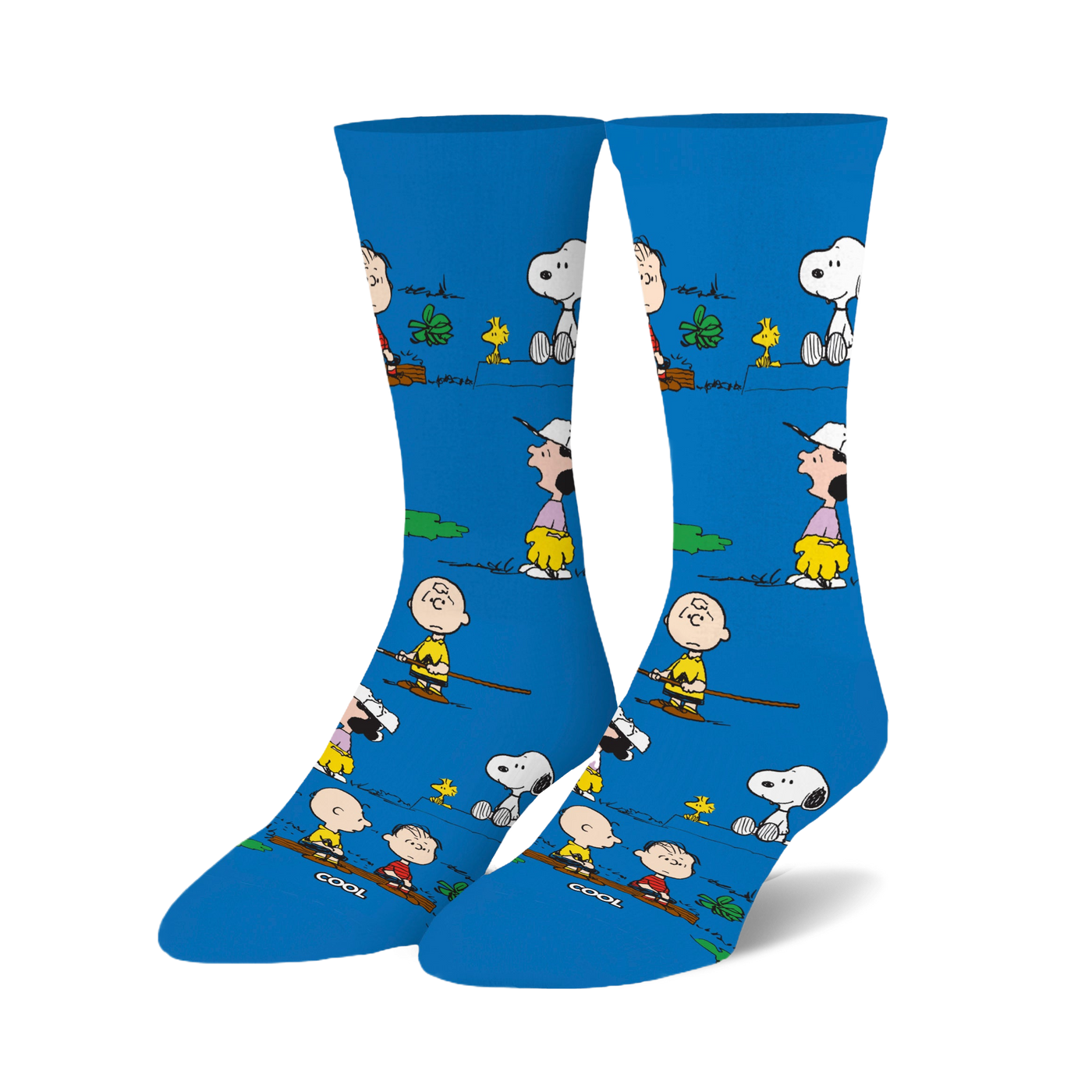 Crew socks in bright blue featuring Peanuts characters like Snoopy and Charlie Brown engaged in outdoor activities. 
