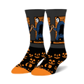 Pair of Halloween II crew socks. Black background with orange jack-o'-lanterns, Michael Myers image and Halloween II text.