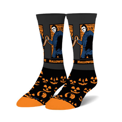 Pair of black crew socks featuring Michael Myers holding a knife and orange jack-o'-lantern patterns.