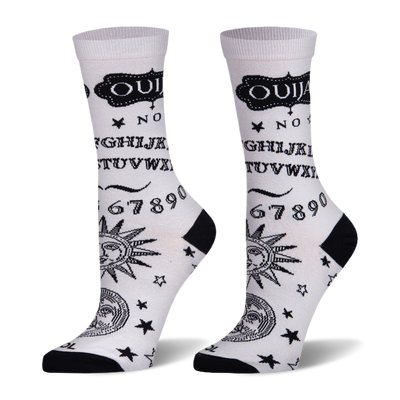 White socks with black Ouija board design showing letters, numbers, stars, and celestial faces. Black heel and toe.