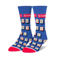 Pair of blue crew socks with a Scrabble tile design.  Tiles are cream and red on a royal blue background. Red and white accents at the cuffs.