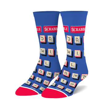 Pair of blue crew socks with a Scrabble tile design.  Tiles are cream and red on a royal blue background. Red and white accents at the cuffs.