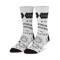 White crew socks with a black Ouija board design, featuring the alphabet, numbers, stars, and vintage sun and moon faces.
