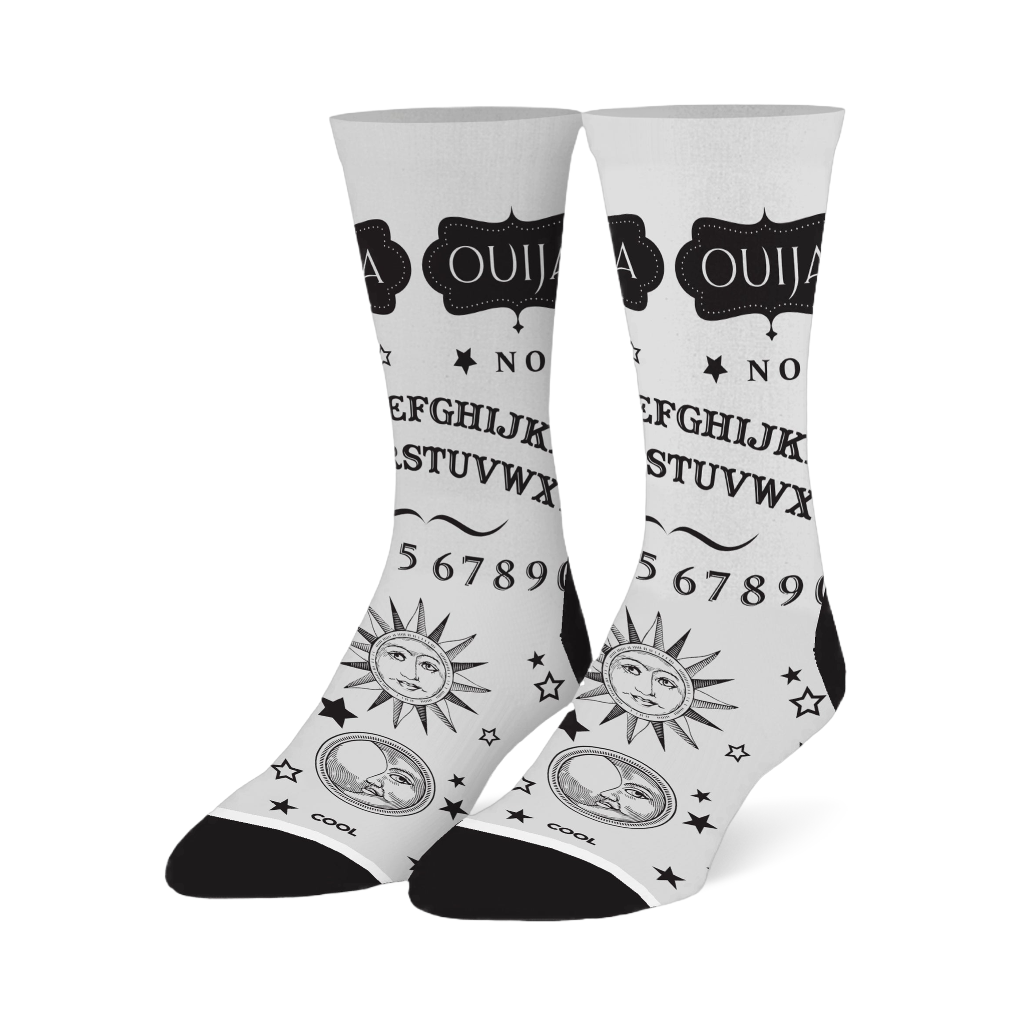 White crew socks with a black Ouija board design, featuring the alphabet, numbers, stars, and vintage sun and moon faces.