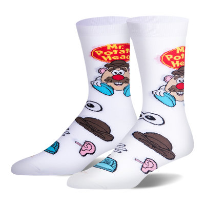 White crew socks featuring the Mr. Potato Head logo and character on the calf, with scattered loose toy parts on the foot.