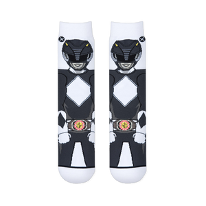 Flat lay of two white socks placed side-by-side, showing the front view of the Black Ranger's helmet, suit, and morpher belt.