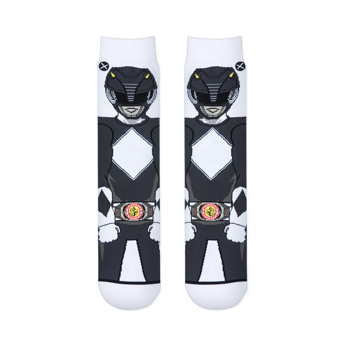 Flat lay of two white socks placed side-by-side, showing the front view of the Black Ranger's helmet, suit, and morpher belt.
