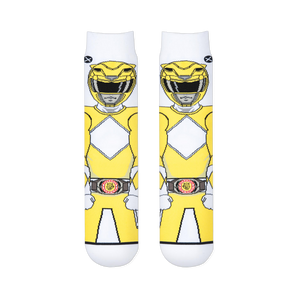 Two white socks laid flat showing the front view of a pixelated Yellow Ranger with a diamond chest pattern and morpher belt.