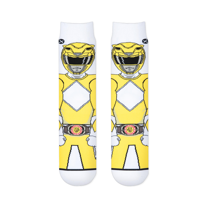 Two white socks laid flat showing the front view of a pixelated Yellow Ranger with a diamond chest pattern and morpher belt.