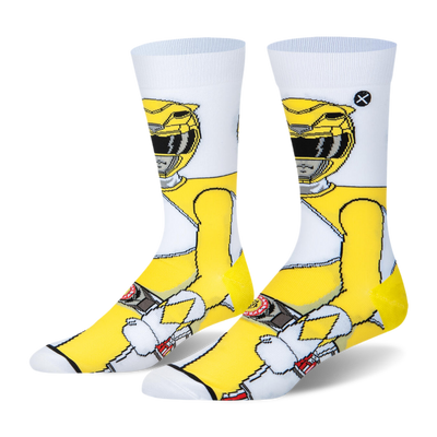 White crew socks featuring a 360-degree pixelated design of the Yellow Ranger in a bright yellow suit and classic helmet.