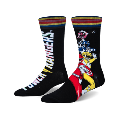 Pair of Power Rangers crew socks with a split design. One sock has the white logo, the other has Red, Yellow, Blue, Pink Rangers. Black, red, yellow, blue striped cuffs.