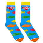 Lifestyle shot: Two pairs of Swedish Fish socks casually draped over a light-colored surface. Shows the socks' design and color well.