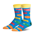 Pair of crew socks with a teal background. Features colorful Swedish Fish candy printed on them, and yellow cuffs with 'Swedish Fish' logo.