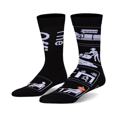 Pair of black crew socks with white designs. Left sock says 'The Office.' Right sock shows Office scenes like Parkour and CPR.
