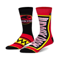 Pair of crew socks, one black with Jurassic Park logo and red accents, the other red with yellow Jurassic Park lettering, both with black and yellow trim.