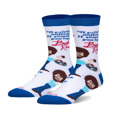 A pair of crew socks with a white background. They feature Bob Ross's portrait, his signature quote, and painting elements. The socks are blue and white.