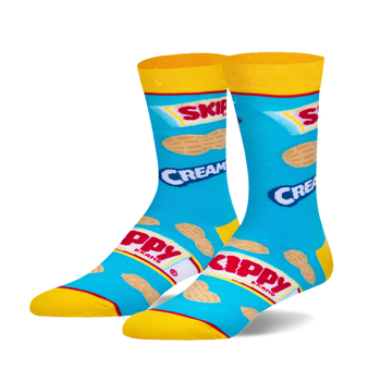 Pair of crew socks, blue background, yellow cuffs, featuring a repeated image of Skippy peanut butter packaging and peanuts.