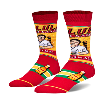 A pair of crew socks showcasing a Cholula hot sauce design.  Red, yellow, and green colors are prominent; the image includes the Cholula bottle and label art.