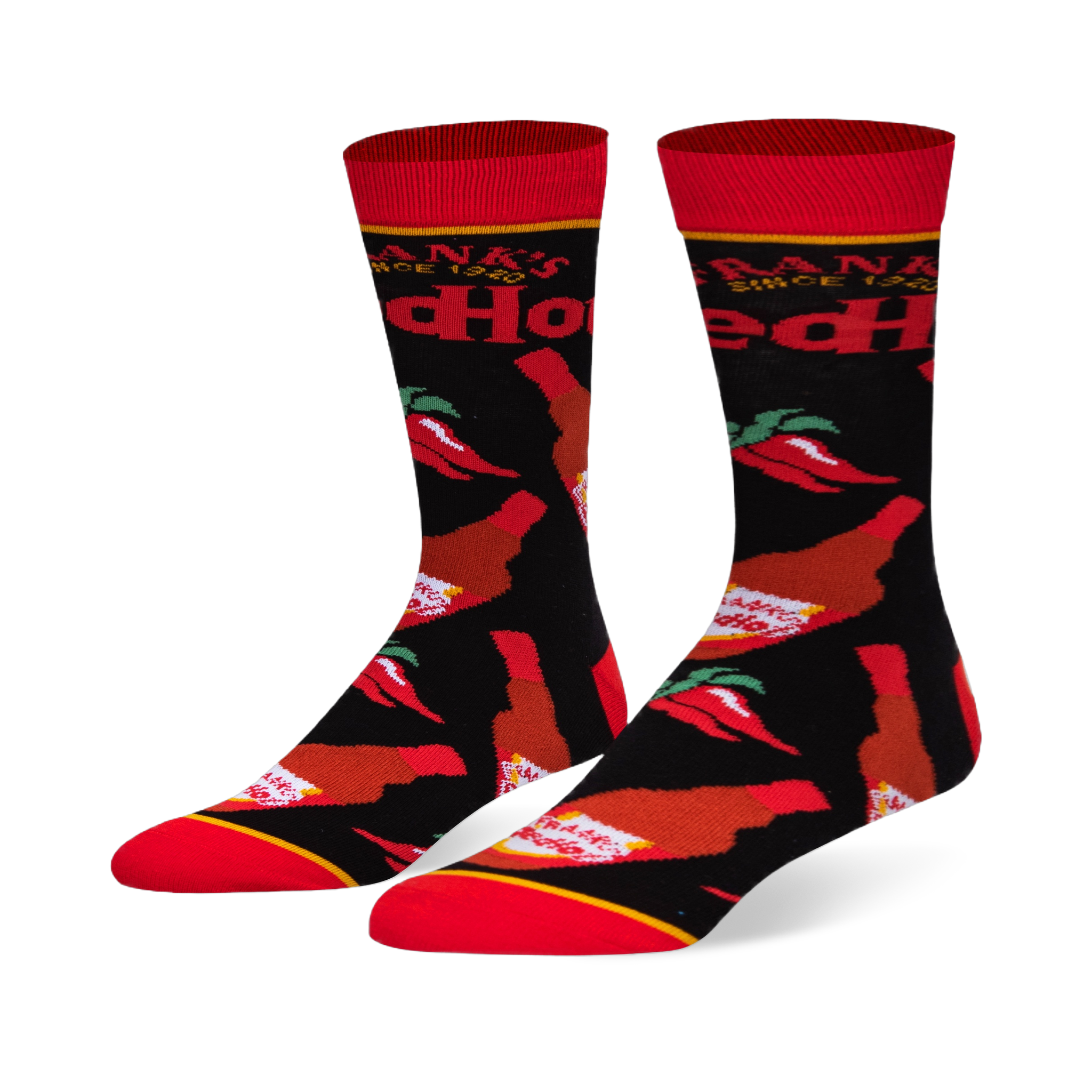 Black crew socks featuring a pattern of Frank's RedHot sauce bottles and red chili peppers, with a bright red toe and cuff.