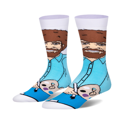Crew socks featuring Bob Ross painting.  Teal, brown, and white colors.  Shows Bob holding a paintbrush and palette.