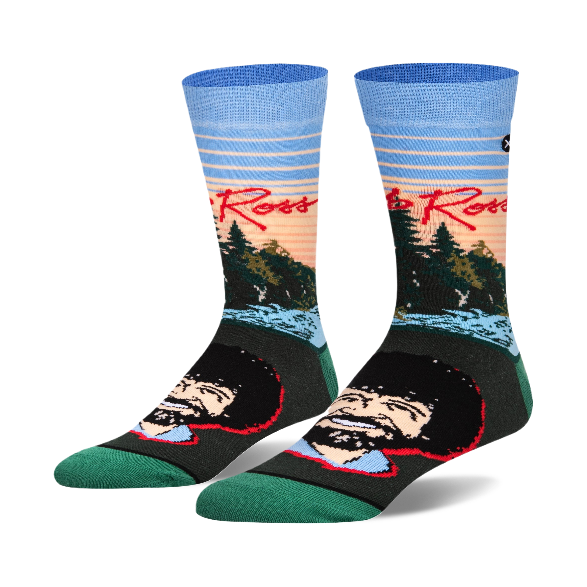 Pair of crew socks featuring Bob Ross's portrait and a sunset landscape.  Colors include teal, light blue, orange, and dark green.