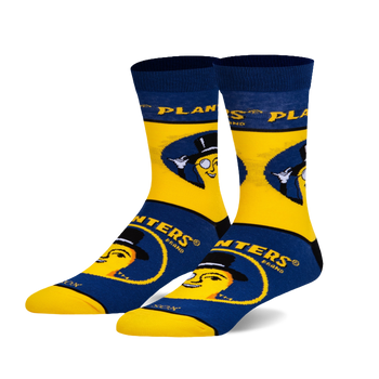 A pair of crew socks in yellow and navy blue. The design features Mr. Peanut, the Planters mascot, wearing a top hat and monocle.
