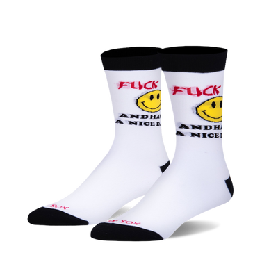 White crew socks with black cuffs, heels, and toes. Features red 'FUCK' text, yellow smiley face, and black 'AND HAVE A NICE DAY'.