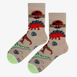 A pair of Jurassic Park dino socks laid flat, showcasing the design details and color scheme.