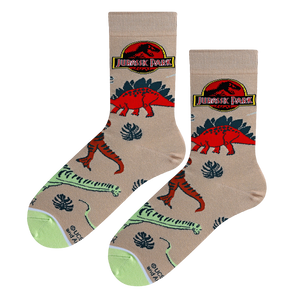 A pair of Jurassic Park dino socks laid flat, showcasing the design details and color scheme.