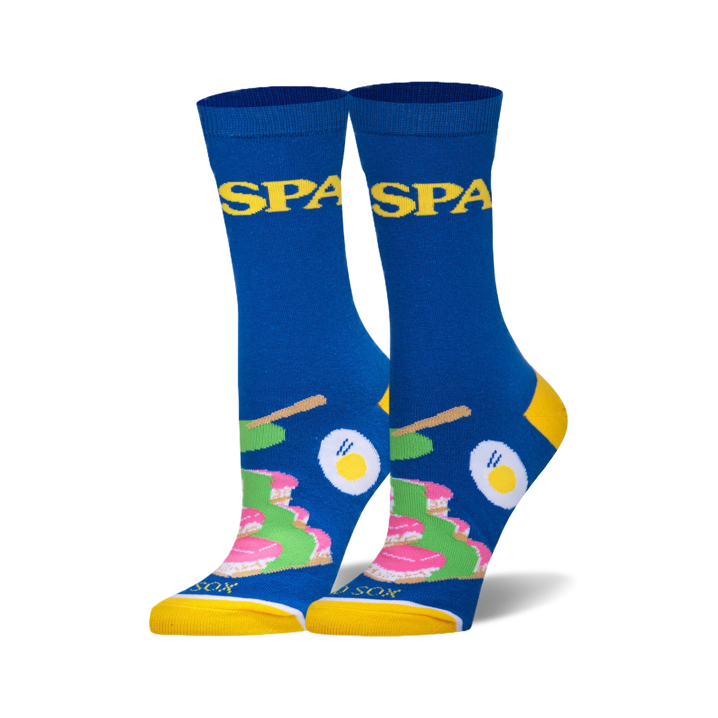 Pair of blue crew socks with yellow cuffs. Features a fun spa-themed design with images of cakes, eggs, and chopsticks, and the word 'Spa' repeated.