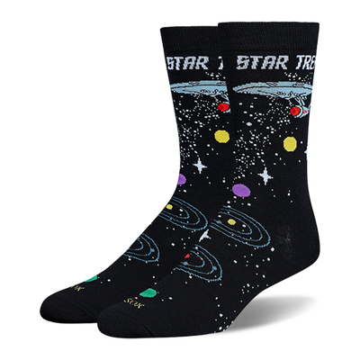 Black Star Trek crew socks showing the USS Enterprise, retro logo text, white stars, and colorful orbiting planets.