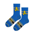 Flat lay of blue socks showing the Starfleet science insignia and Star Trek text across the striped foot.