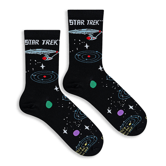 Flat lay of black Star Trek socks showing the USS Enterprise, blue orbital rings, white stars, and colorful planets.