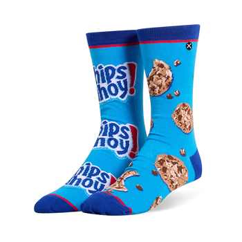 Mismatched bright blue crew socks. One has stacked Chips Ahoy! logos, the other has chocolate chip cookies and loose chips.