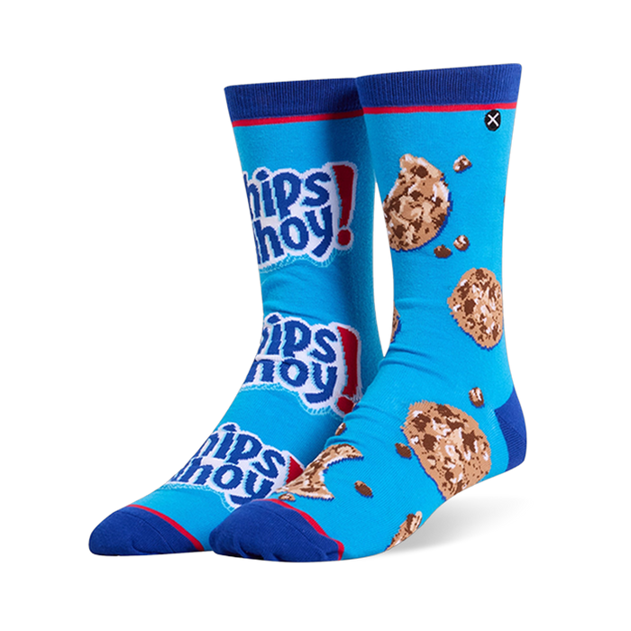 Mismatched bright blue crew socks. One has stacked Chips Ahoy! logos, the other has chocolate chip cookies and loose chips.