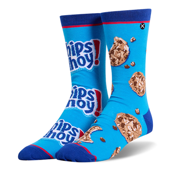 Mismatched bright blue crew socks. One has stacked Chips Ahoy! logos, the other has chocolate chip cookies and loose chips.