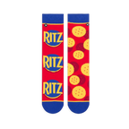 Flat lay of red mismatched socks. Left sock shows three stacked Ritz logos. Right sock displays a scattered cracker pattern.