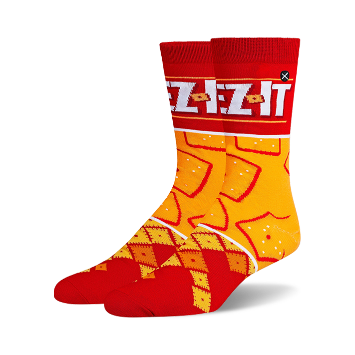Pair of crew socks in red and orange.  Features a Cheez-It box design at the top and a pattern of Cheez-It crackers.