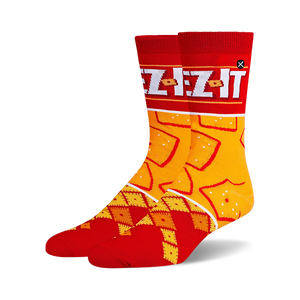 Pair of crew socks in red and orange.  Features a Cheez-It box design at the top and a pattern of Cheez-It crackers.