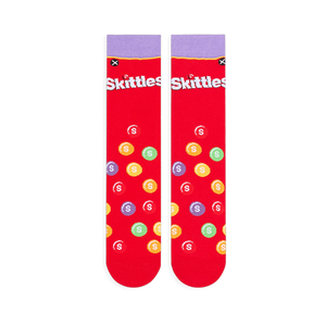 Flat lay of two red Skittles socks showing the light purple cuff, white logo, and scattered multi-colored candy pattern.